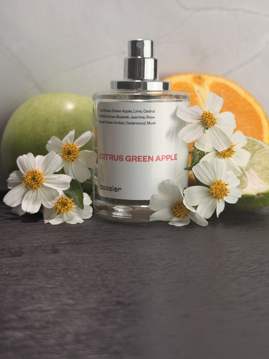 Dossier Citrus Green Apple perfume styled with white flowers, green apple, orange and lime